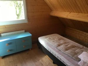 Ένα ή περισσότερα κρεβάτια σε δωμάτιο στο Huisje voor 2 personen