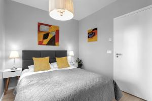 Postel nebo postele na pokoji v ubytování Tower Apartments