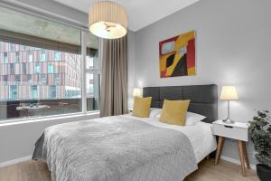 Postel nebo postele na pokoji v ubytování Tower Apartments