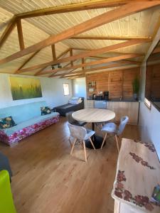 a large living room with a table and chairs at NOCLEGI AGRO-RELAX in Kozielice