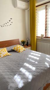 מיטה או מיטות בחדר ב-Appartamento Zena