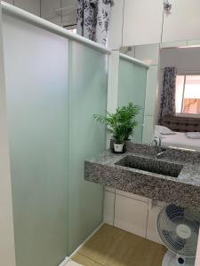 a bathroom with a sink and a mirror at HOTEL POUSADA POR DO SOL in Pato Branco