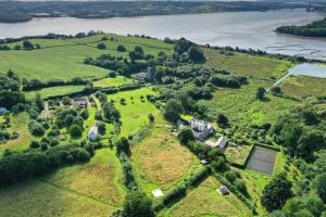 an aerial view of an estate on the banks of a river at Lower Marsh Farm in Cornwall in Saltash