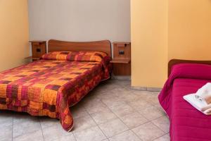 Posteľ alebo postele v izbe v ubytovaní Fontanarosa Residence
