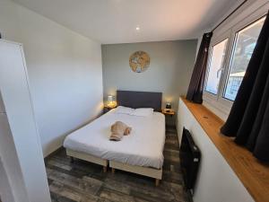 En eller flere senge i et værelse på Casita Hendaya - Agréable et cosy avec parking et WiFi