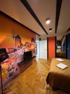 TV a/nebo společenská místnost v ubytování MM Apartman