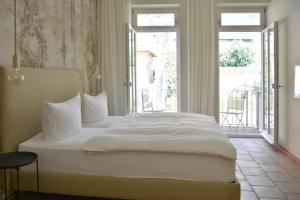 Un pat sau paturi într-o cameră la Albergo-Toscana