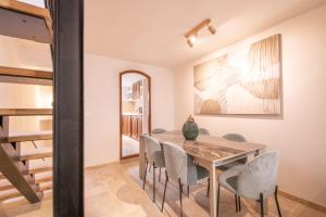 a dining room with a table and chairs at Pick A Flat's Townhouse in Saint-Tropez - Rue Sainte-Barbe in Saint-Tropez