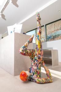a statue of a person with their arms in the air at Ekilibrio Hotel & Apart-Suites in Madrid