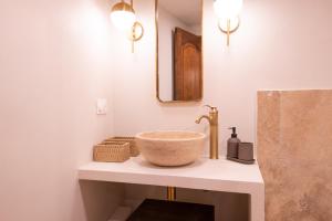 a bathroom with a bowl sink on a counter at Pick A Flat's Townhouse in Saint-Tropez - Rue Sainte-Barbe in Saint-Tropez