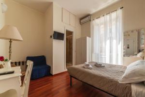 A bed or beds in a room at 4-rooms flat at Vatican