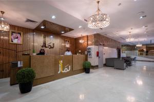 a lobby of a restaurant with a reception desk at لمار أجياد الاول Tower B in Makkah