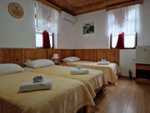 Voodi või voodid majutusasutuse Hotel Domino toas
