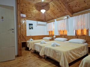 Voodi või voodid majutusasutuse Hotel Domino toas