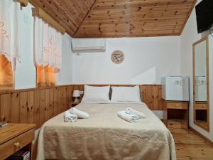 Voodi või voodid majutusasutuse Hotel Domino toas