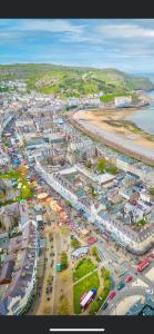 an aerial view of a parking lot next to the beach at The Copthorne in Colwyn Bay