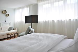 Un pat sau paturi într-o cameră la Albergo-Toscana