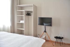 Un televizor și/sau centru de divertisment la Albergo-Toscana
