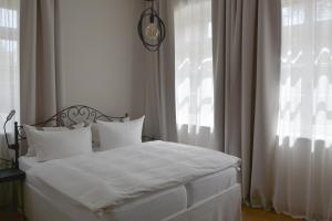 Un pat sau paturi într-o cameră la Albergo-Toscana