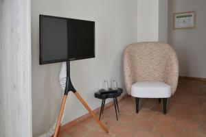 Un televizor și/sau centru de divertisment la Albergo-Toscana