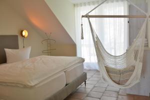 Un pat sau paturi într-o cameră la Albergo-Toscana