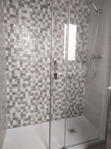 a shower with a glass door in a bathroom at MARiPEP Playa Vinaròs in Vinaròs