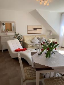 a living room with a couch and a table at Appartment Strandstraße 29 Wohnung Nr. 16 in Trassenheide