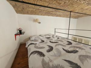a bedroom with a bed in a white room at RomeCentro 5minuti dalla stazione in Rome