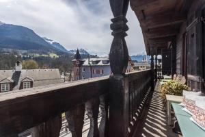 a balcony with a view of a town and mountains at Ferienappartement 2 - Lockstein in Berchtesgaden