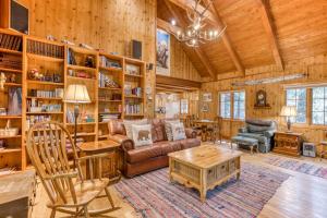 a living room with a couch and a table at Papa Bear Cabin in Welches