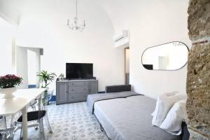 Un televizor și/sau centru de divertisment la iFlat Dimora del Cassaro