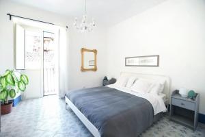 Un pat sau paturi într-o cameră la iFlat Dimora del Cassaro