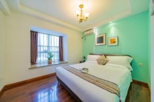 Ένα ή περισσότερα κρεβάτια σε δωμάτιο στο Yue Ke Apartment - Changbin Road Branch