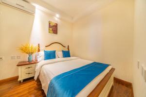 Ένα ή περισσότερα κρεβάτια σε δωμάτιο στο Yue Ke Apartment - Changbin Road Branch