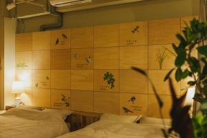 Postel nebo postele na pokoji v ubytování DENCHI TOKYO - Private Designer Stay in Asakusa