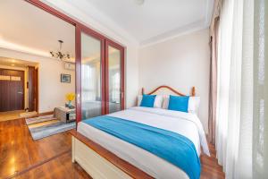 Ένα ή περισσότερα κρεβάτια σε δωμάτιο στο Yue Ke Apartment - Changbin Road Branch