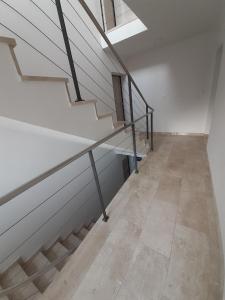 an empty hallway with a staircase in a building at Luxury apartments Aronia in Vantačići