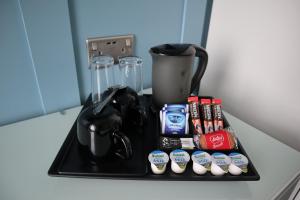 a black tray with a blender on a counter at Marina View Guest House in Irvine