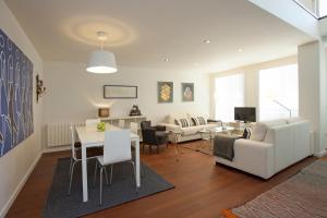 a living room with a couch and a table at SingularStays Miracle in Valencia