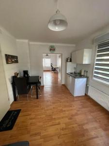 a kitchen and living room with a table and a dining room at Apartment Marielena 2 in Püttlingen