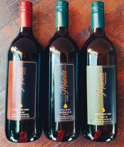 three bottles of wine sitting next to each other at Vista Capodistria in Koper