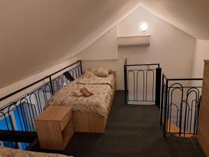 a bedroom with a bed with shoes on it at Daka in Vrnjačka Banja
