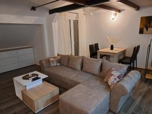 a living room with a couch and a table at Daka in Vrnjačka Banja