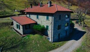 an aerial view of a house with a red roof at Il Larice - Agriturismo Alpe del Ville San Primo by Wonderful Italy in Bellagio