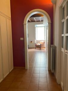 an open hallway with an archway in a house at Laterano Apartment in Rome