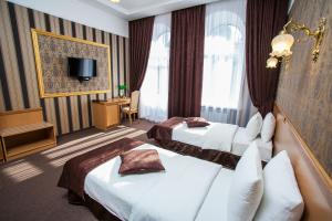 Postel nebo postele na pokoji v ubytování Hotel Litera