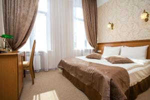 Postel nebo postele na pokoji v ubytování Hotel Litera