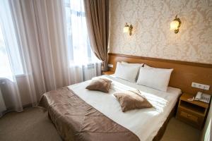 Postel nebo postele na pokoji v ubytování Hotel Litera
