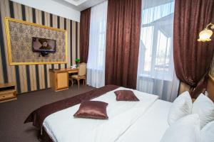 Postel nebo postele na pokoji v ubytování Hotel Litera