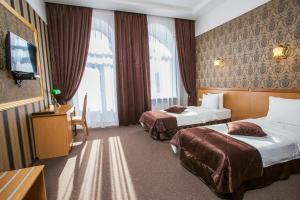 Postel nebo postele na pokoji v ubytování Hotel Litera